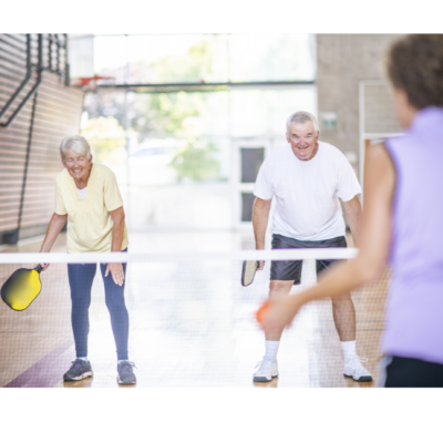 people playing pickleball indoors