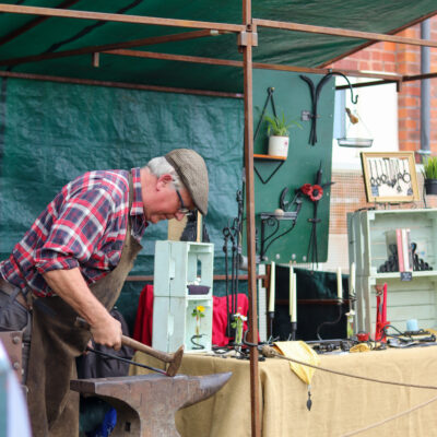 Local blacksmith at fete